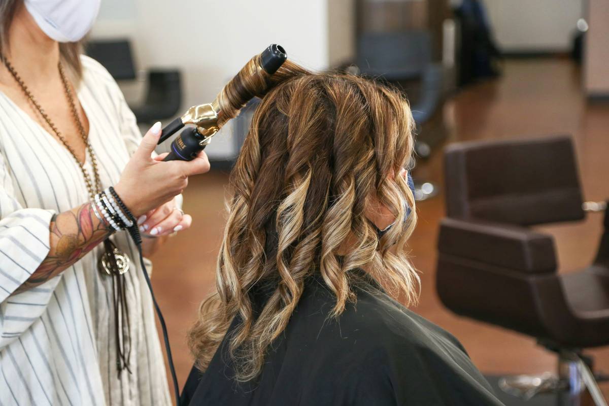 Hair highlight experts applying foils during a salon session